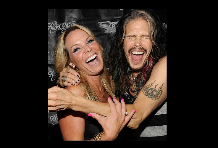Woman smiling with Steven Tyler