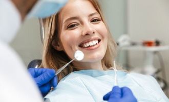 Happy patient visiting BlueCross BlueShield Dentist in Massapequa Park