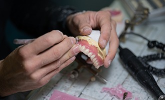 Lab tech carving dentures