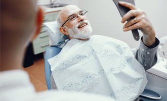Man smiling with dental implants in Massapequa Park