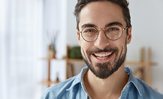 young man with dental implants in Massapequa Park 