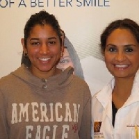Massapequa Park dentist standing next to young woman