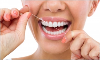 Patient putting on clear aligner in treatment room