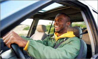 Patient putting on clear aligner in treatment room