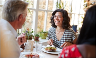Patient putting on clear aligner in treatment room
