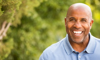 older man bald head smiling