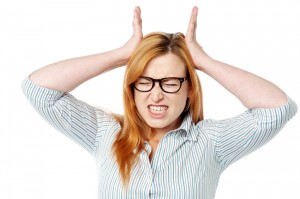 woman with headache from teeth grinding