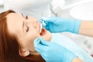 relaxed patient receive dental care