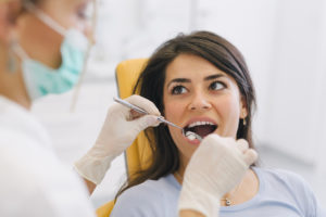 Woman receiving dental exam