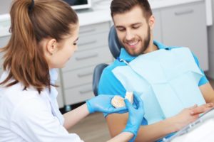 a male patient talking to his dentist