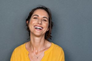 woman smiling with dental implants